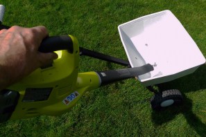Blowing out a fertilizer spreader with a leaf blower